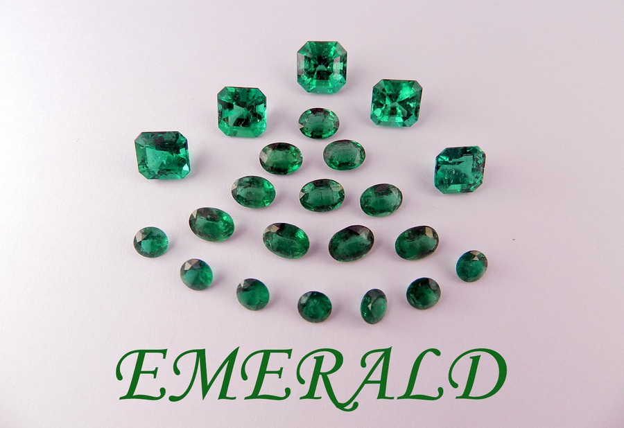 Emerald gemstones arranged in a fan shape with the word 'EMERALD'