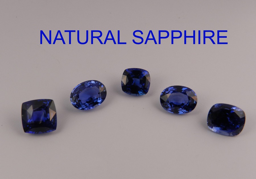 Close-up of several faceted blue stones titled 'NATURAL SAPPHIRE'